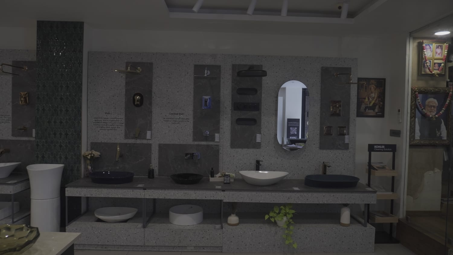 Customer browsing luxury Kohler bathroom faucets and tiles at Aquastilez Hyderabad